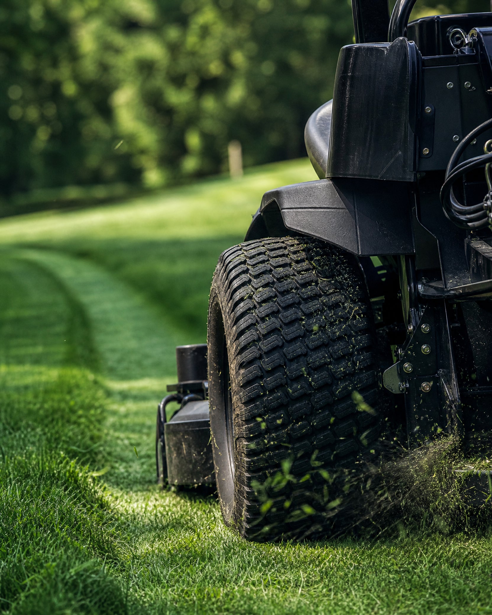 Commercial mower leaving a fresh-cut stripe